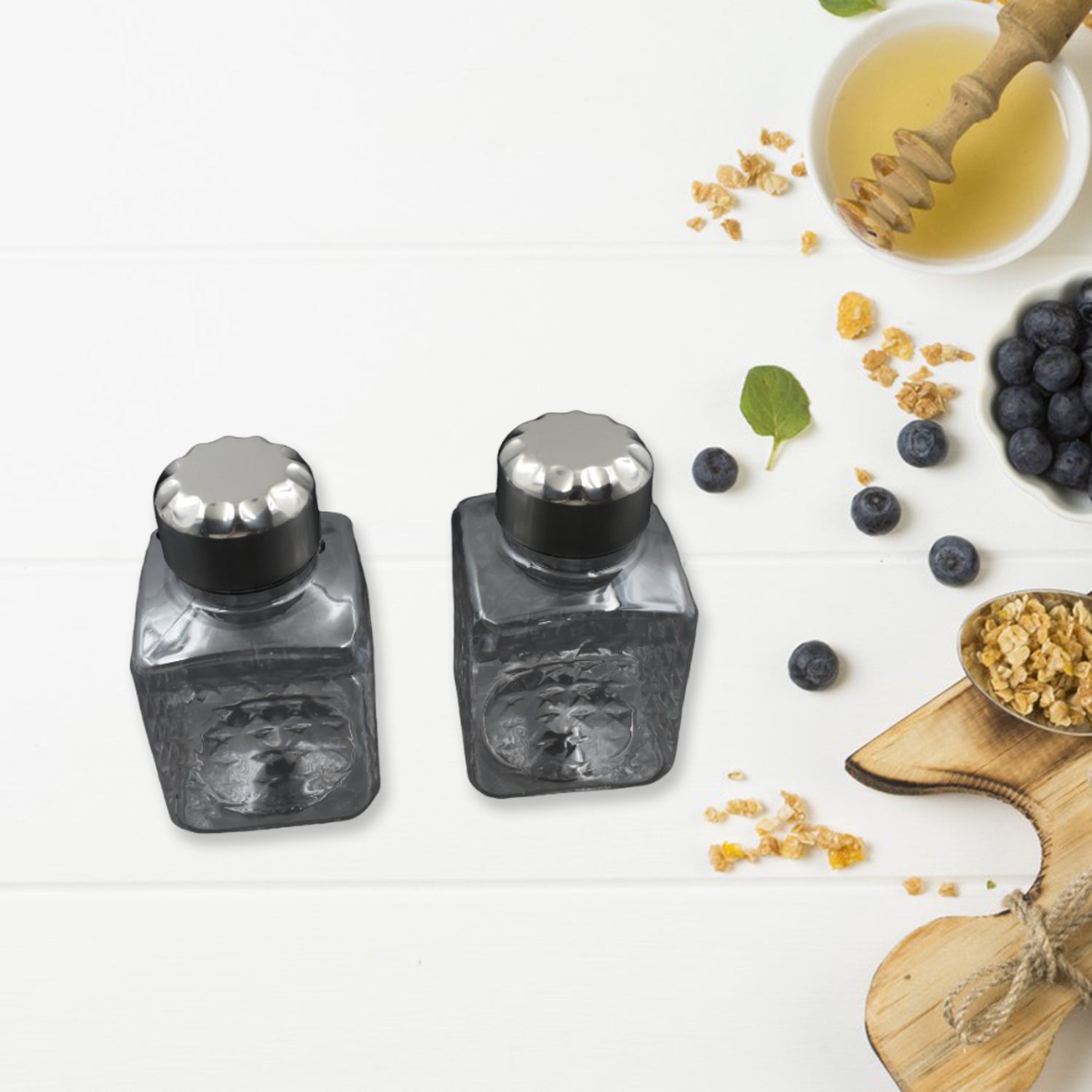 Square container set in a rotating spice rack for kitchen use Square container set in a rotating spice rack for kitchen use